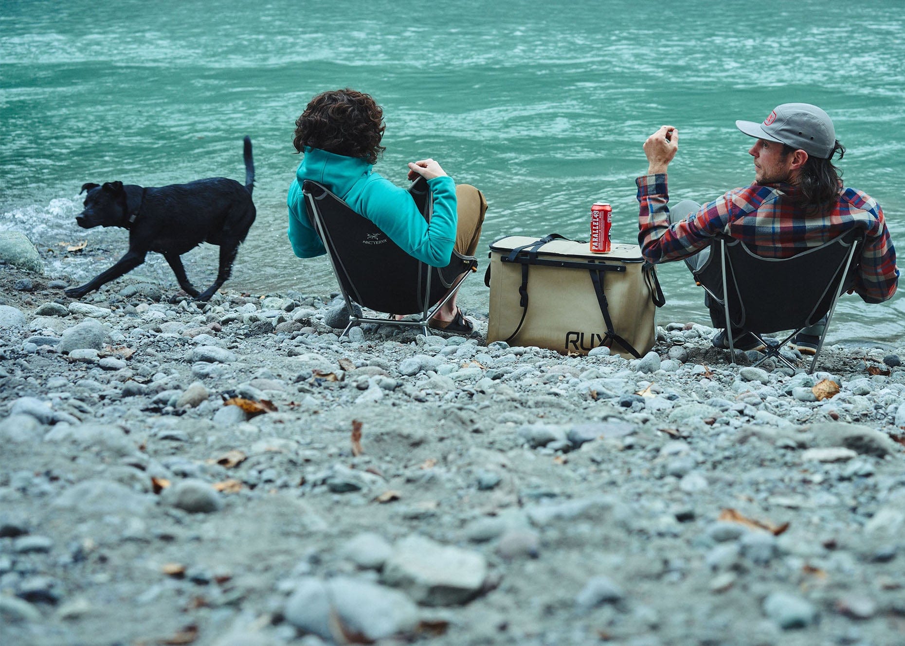 RUX designers with an early RUX 70L on a beach.